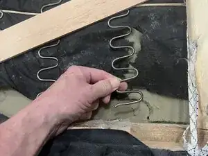 How to Fix a Dislodged Couch Spring
