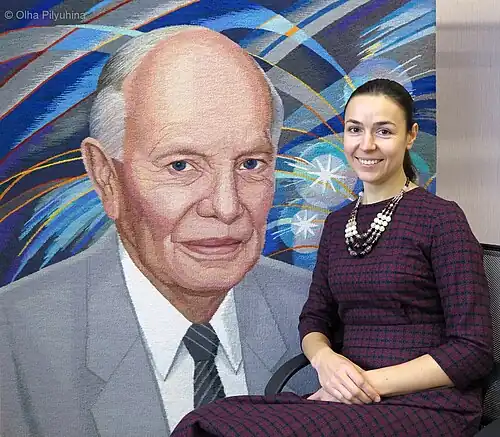 The artist Olha Pilyuhina. and the portrait of Borys Paton