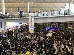 Hong Kong 2019, Liberate Hong Kong banner inside airport