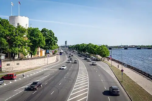11. novembra krastmala embankment in Riga, Latvia with the castle of Riga visible in the background