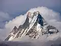 A mountain such as Machapuchare in Nepal has a clearly discernible top and bottom, but is not clearly differentiated along other dimensions, though people may designate a front, back, and sides.
