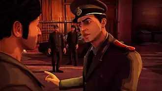 The player character is facing a police officer, who is berating him. Two officers stand in the background, near a police cruiser.