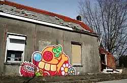 Street art by Ces53 in Doel. Since the depopulation of Doel, it is attracting street artists.