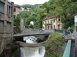 Narrow river valley, with bridges and buildings