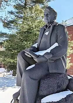 Statue of poet Robert Frost, sculpted by Penelope Jencks, and installed at Amherst College in Amherst, Massachusetts.