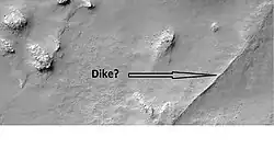 Possible dike in Thaumasia quadrangle, as seen by HiRISE under the HiWish program. Dikes may have deposited valuable minerals.