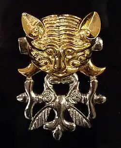 Catlike predator with protomas of two elk, burial mound Berel (4th-3rd centuries BC) Kazakhstan, Pazyryk culture.