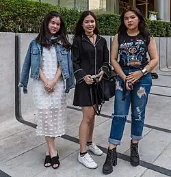 Bangkok streetwear in 2017, blending soft sheers with workwear inspired denim and ripped jeans.