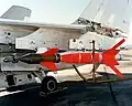 An AGM-123A Skipper II low-level laser-guided missile mounted on the wing pylon of a Vought A-7
