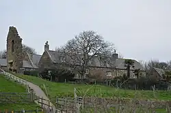 The Grade II listed Abbey House, with the gable of the Grade I listed Malthouse on the extreme right