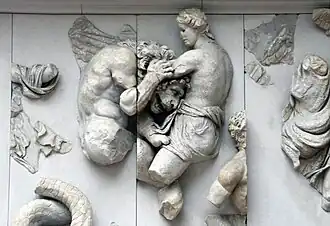 Aether, fighting a lion-headed Giant, on a frieze