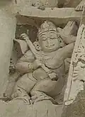 India, 7th-8th century C.E. Figure holding an Alapini vina at Kailasanathar Temple