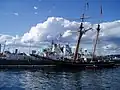 Sackville, Halifax Harbour, 1 July 2007, alongside a 2-masted sailing ship. A green maple leaf badge is visible on the ship's funnel, a common insignia of Royal Canadian Navy during World War II.