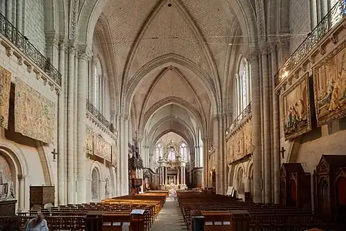 The nave and choir seen from inside the west front, showing the tapestries