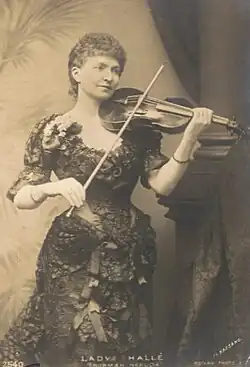 The portrait features a woman in her twenties in a gown playing the violin.