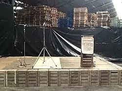 Beatles stage, made with produce crates. Rebuilt for 50th anniversary, 2014.