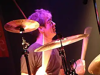Bill Berry behind a drum kit