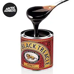 A shot of black treacle on a metal spoon on a white background. The band name is on a black circle in the top left corner.