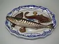 Palissy majolica c. 1880. Platter is opaque white tin-glazed with cobalt oxide brush-painted decoration, and the applied fish are of coloured glazes majolica.