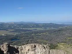 View from Breccia Peak to west, to Teton Range, Lost Lake in the foreground.