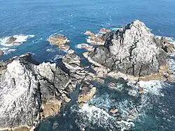 The Brisons from above The Brisons seen from Porth Nanven beach