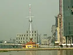 Thủ Ngữ flagpole, behind is the ventilation tower of Thủ Thiêm Tunnel
