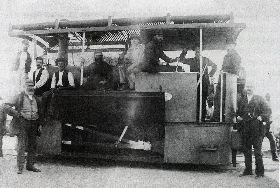 Possibly John Taylor, with cab roof installed and motion exposed, c. 1886