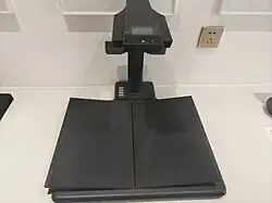 The CZUR M3000 book scanner features a V-shaped cradle that protects books during scanning, ensuring their preservation.