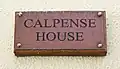 Plaque at the entrance to Calpense House.