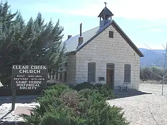 The Clear Creek Church was built in 1898 and is located on Clear Creek Road 3.5 mi. SE of Camp Verde. The builders placed in the cornerstone of the building a bible and a $5 gold piece (which was chiseled away in the 1920s). It was Camp Verde’s only church until 1913, when it was transformed into the city’s one-room schoolhouse. In 1946, the church was abandoned. Today Clear Creek Church is looked after by the Camp Verde Historical Society. It was listed in the National Register of Historic Places on August 6, 1975, reference #75000362.