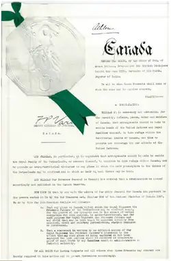Typewritten proclamation, signed by Athlone and counter-signed by the Deputy Minister of Justice, with Great Seal of Canada and a green ribbon
