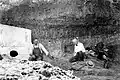 Carl Schwachheim (left) shows the Folsom point, in its original excavation context, to visiting paleontologist Barnum Brown, 4 September 1927