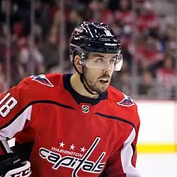 Ice hockey player in a red Washington Capitals jersey