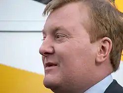 A picture of a middle-aged Caucasian man with short reddish-brown hair.