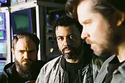 Clipping in a 2025 promotional picture. Left to right: Snipes, Diggs, and Hutson.