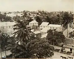 Sepia photograph of a street seen from the rooftops