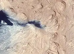 Crommelin crater layered deposit, as seen by HiRISE. The color blue in the photo is a false color.