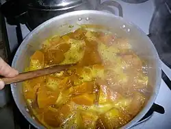 Smashing cubes in the pot.