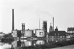 Black and white photo depicting large industrial cylindrical containers in Uithoorn