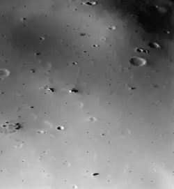 The surface of Deimos, a moon of Mars, is covered by a layer of regolith estimated to be 50 m (160 ft) thick. Viking 2 orbiter image is from a height of 30 km (19 mi).