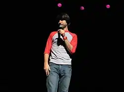 Martin standing with a microphone