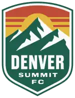 A shield depicting a green and white mountain range against a yellow sun and dark orange sky.