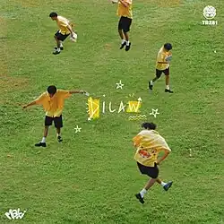 A man wearing a yellow polo shirt, black shorts, and shoes doing various poses in a grass field. The poses include jumping and walking arms-wide while looking at the ground.