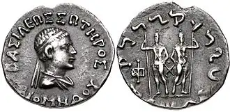 Silver coin of Diomedes. The obverse shows King bareheaded and wearing a diadem, with surrounding Greek legend. The reverse shows the Dioscuri standing, and with the Kharoshti legend on the outside.