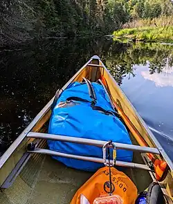 A drybag in a canoe.