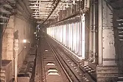 Reserved platform structure in the Line 6 eastbound tunnel, screen doors installed (September 2022)