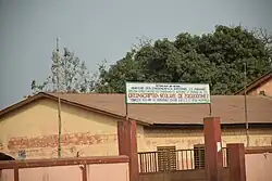 School building with trees in background