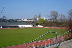 Association football pitch,, surrounded by running track
