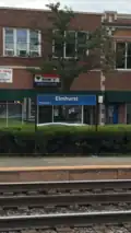 A platform sign at Elmhurst station.