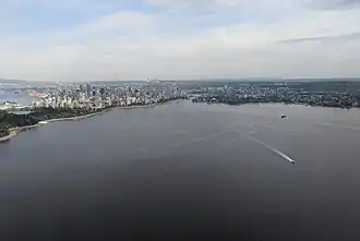 Aerial photo of English Bay looking east, including downtown, the West End, and Kitsilano